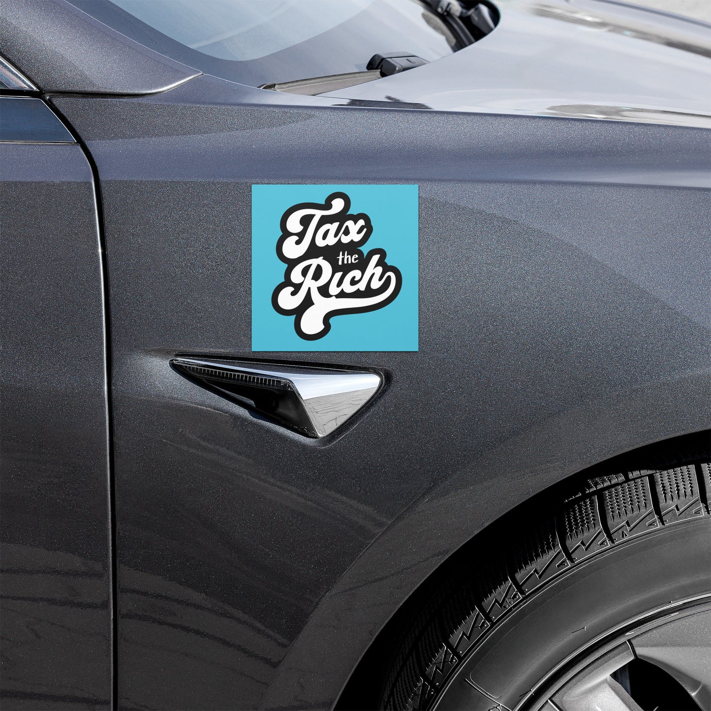 Car with 'Tax the Rich' sticker on a blue background