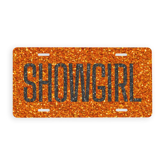 Orange glittery license plate with 'SHOWGIRL' text on a white background