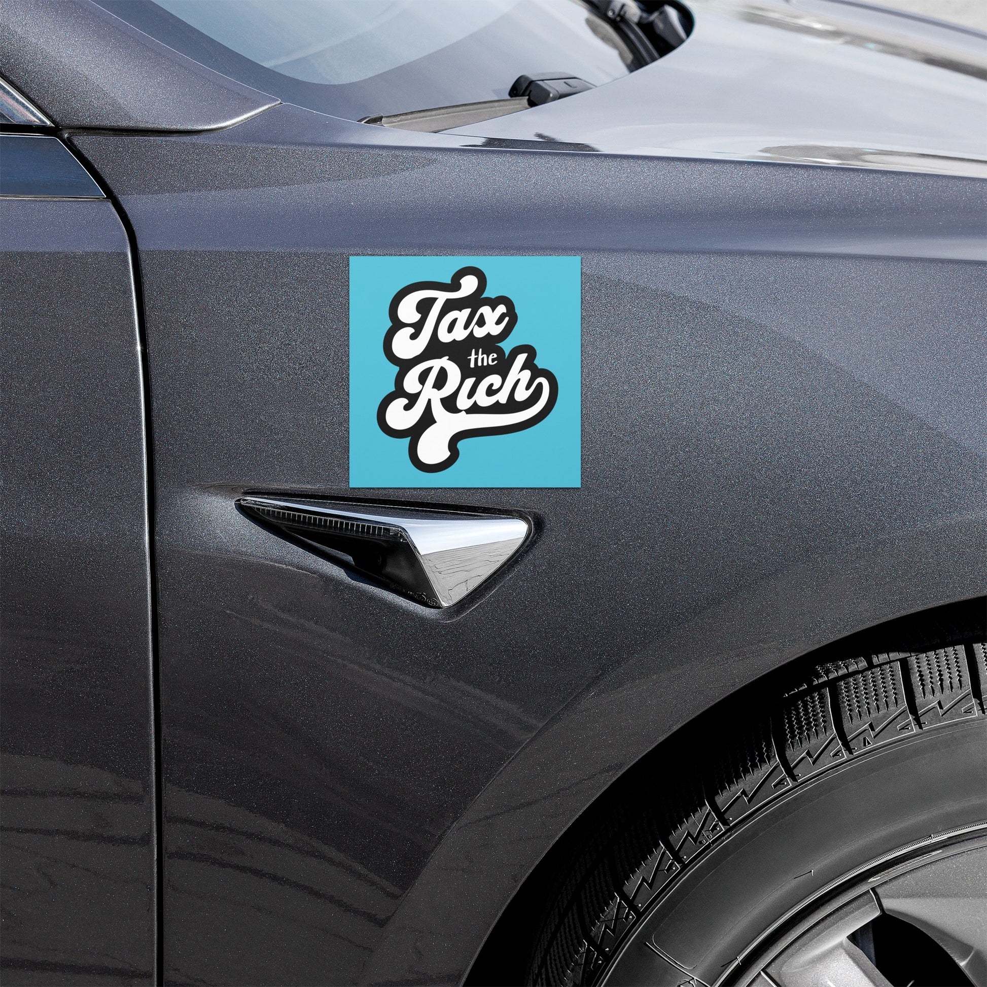 Car with 'Tax the Rich' sticker on a blue background