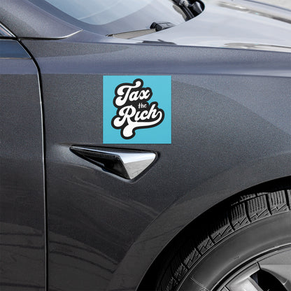 Car with 'Tax the Rich' sticker on a blue background